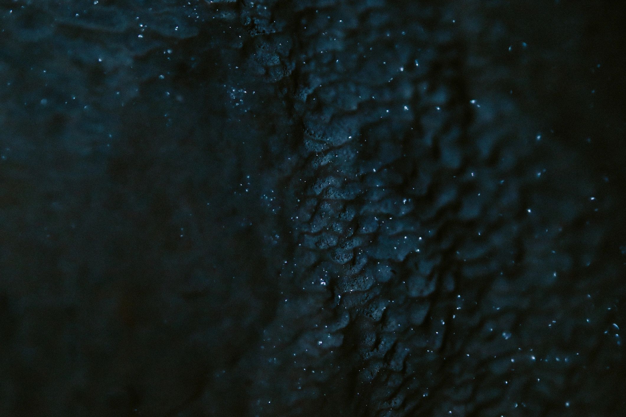 Cave interior stone details with layered rock surfaces