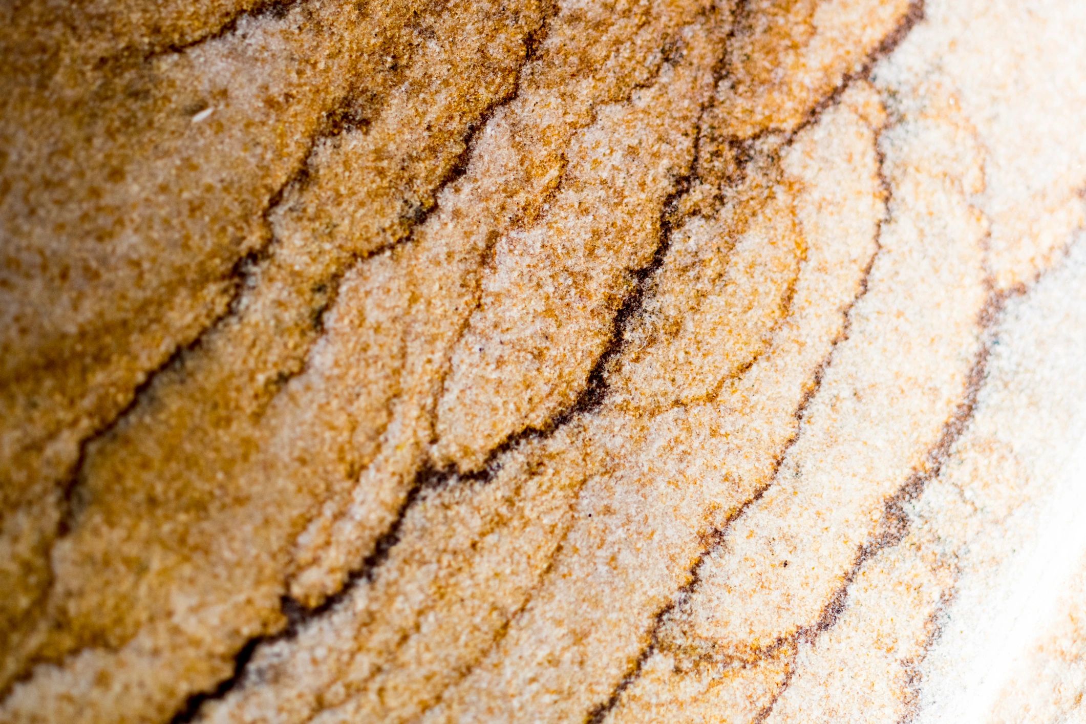 Layered stone texture in warm tones, macro detail