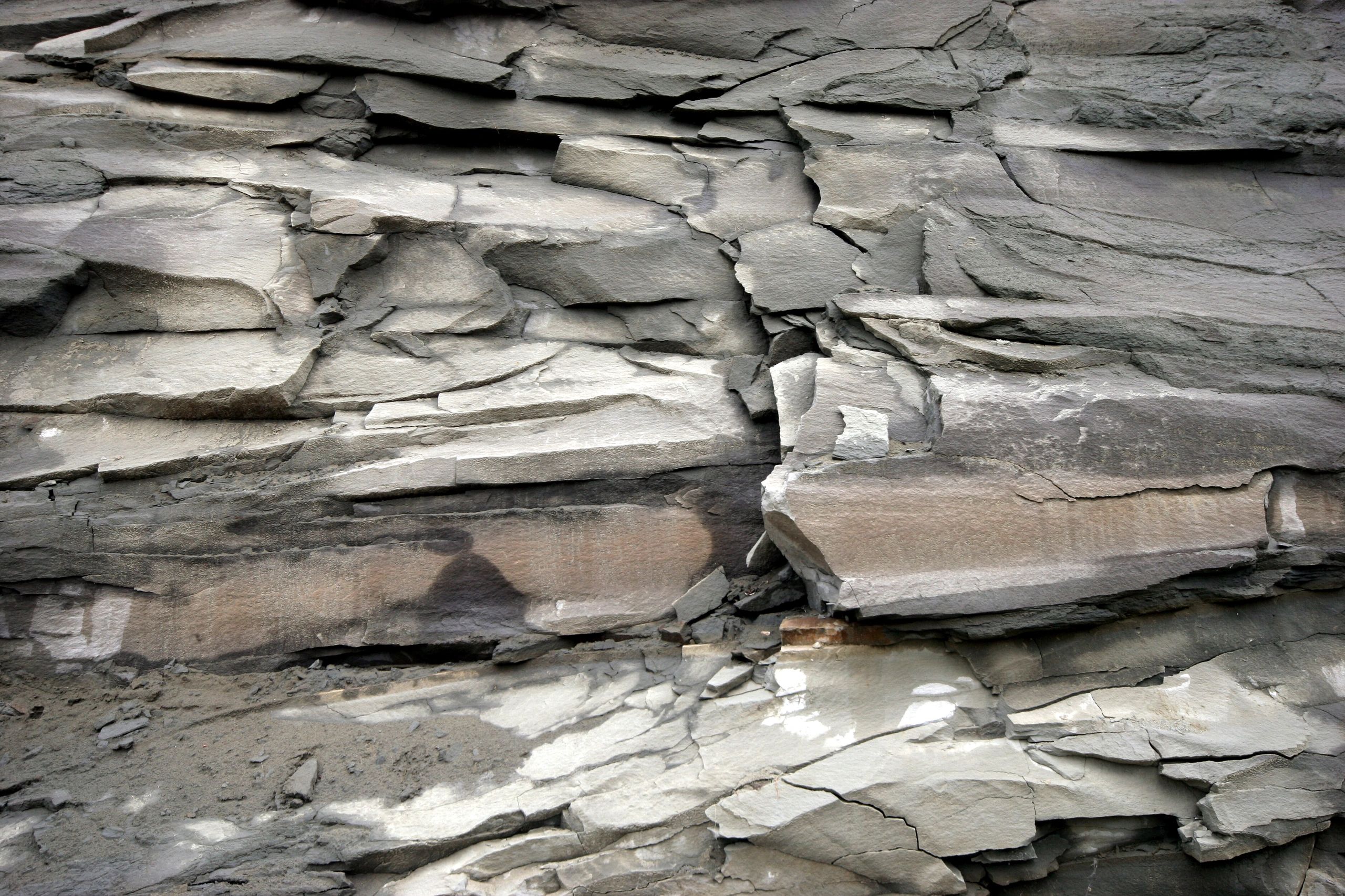 Close-up of layered rock face showing sedimentary bedding