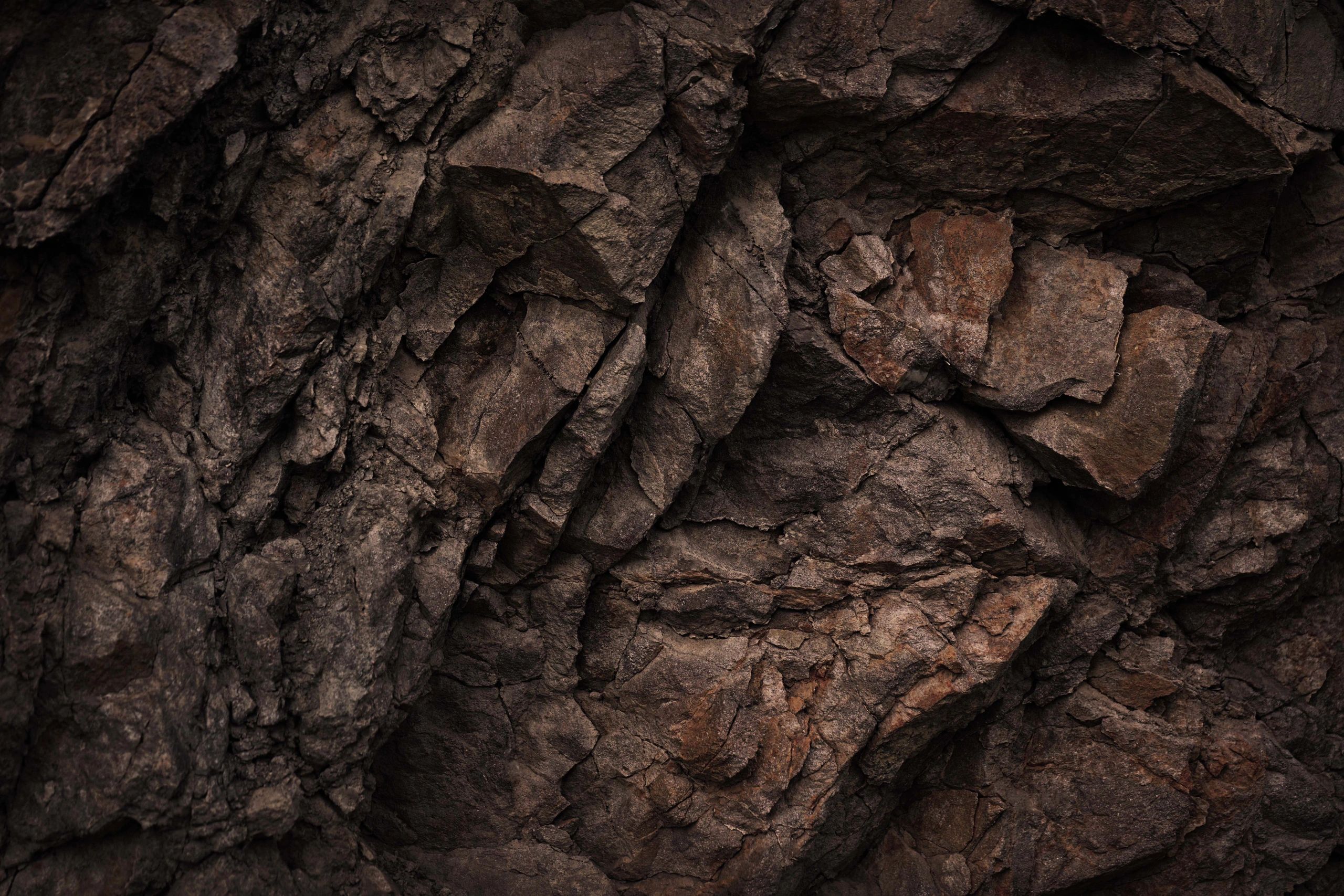 Dark basalt-like rock surface texture