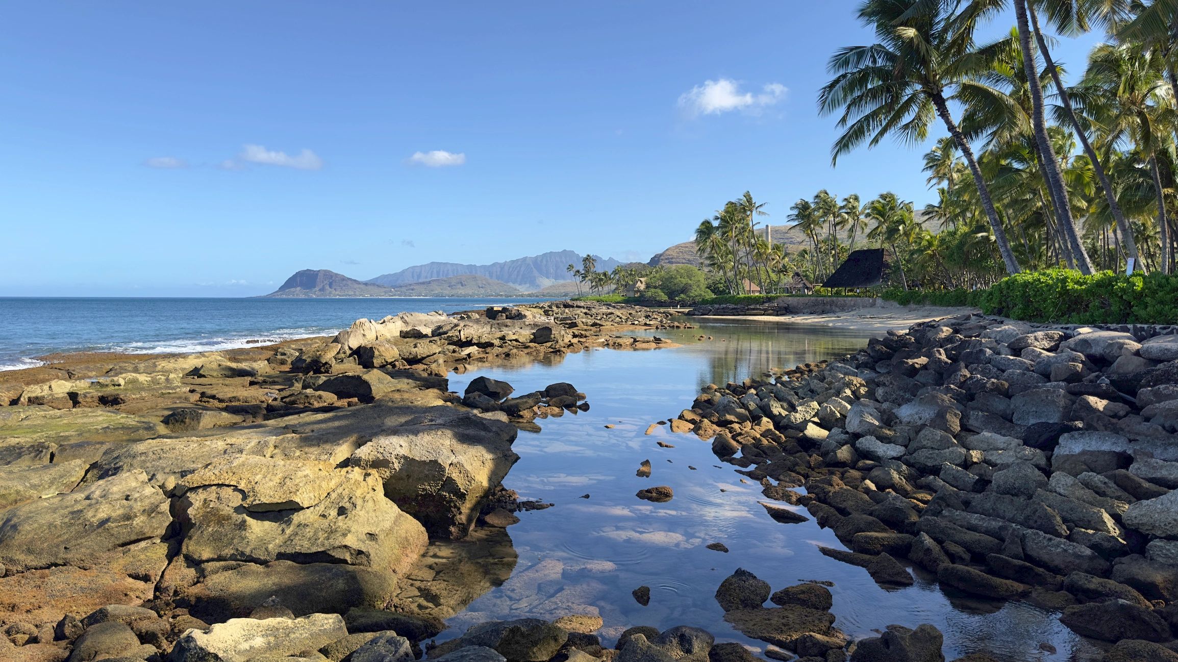 Hawaiian coastline with beach and stream at Ko Olina, Oahu