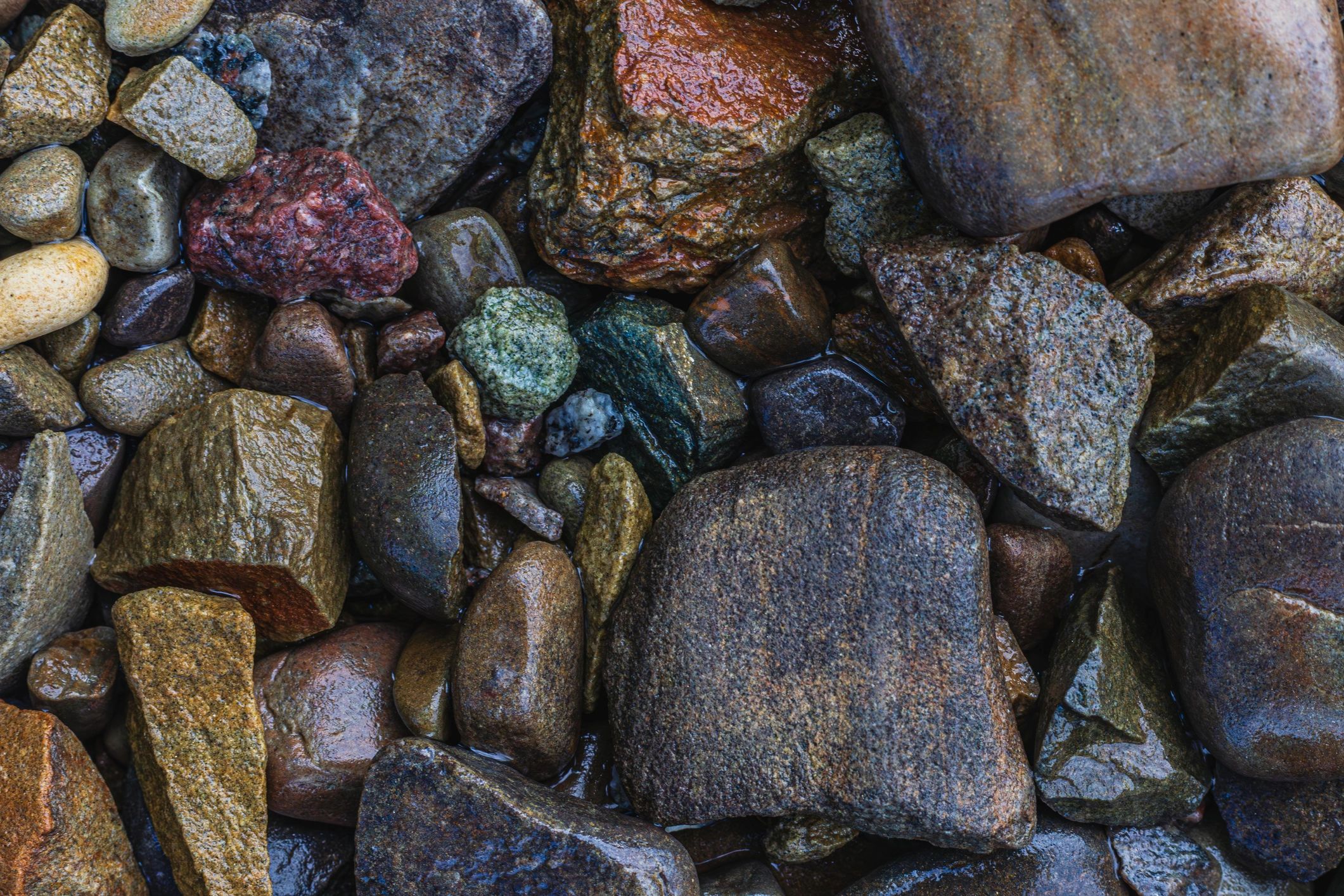 Top view of rounded river pebbles and mixed stones