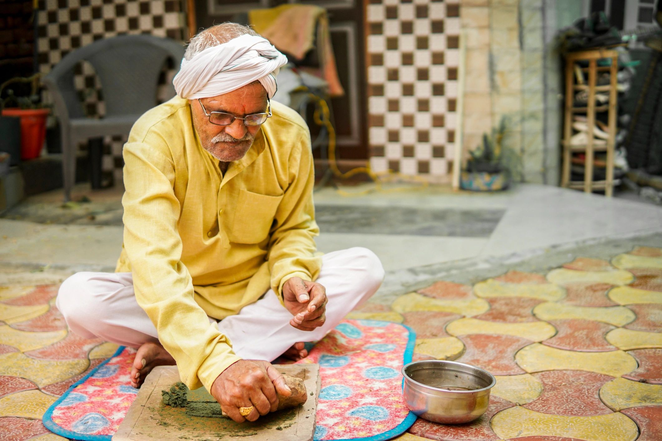 Person using a traditional stone grinder