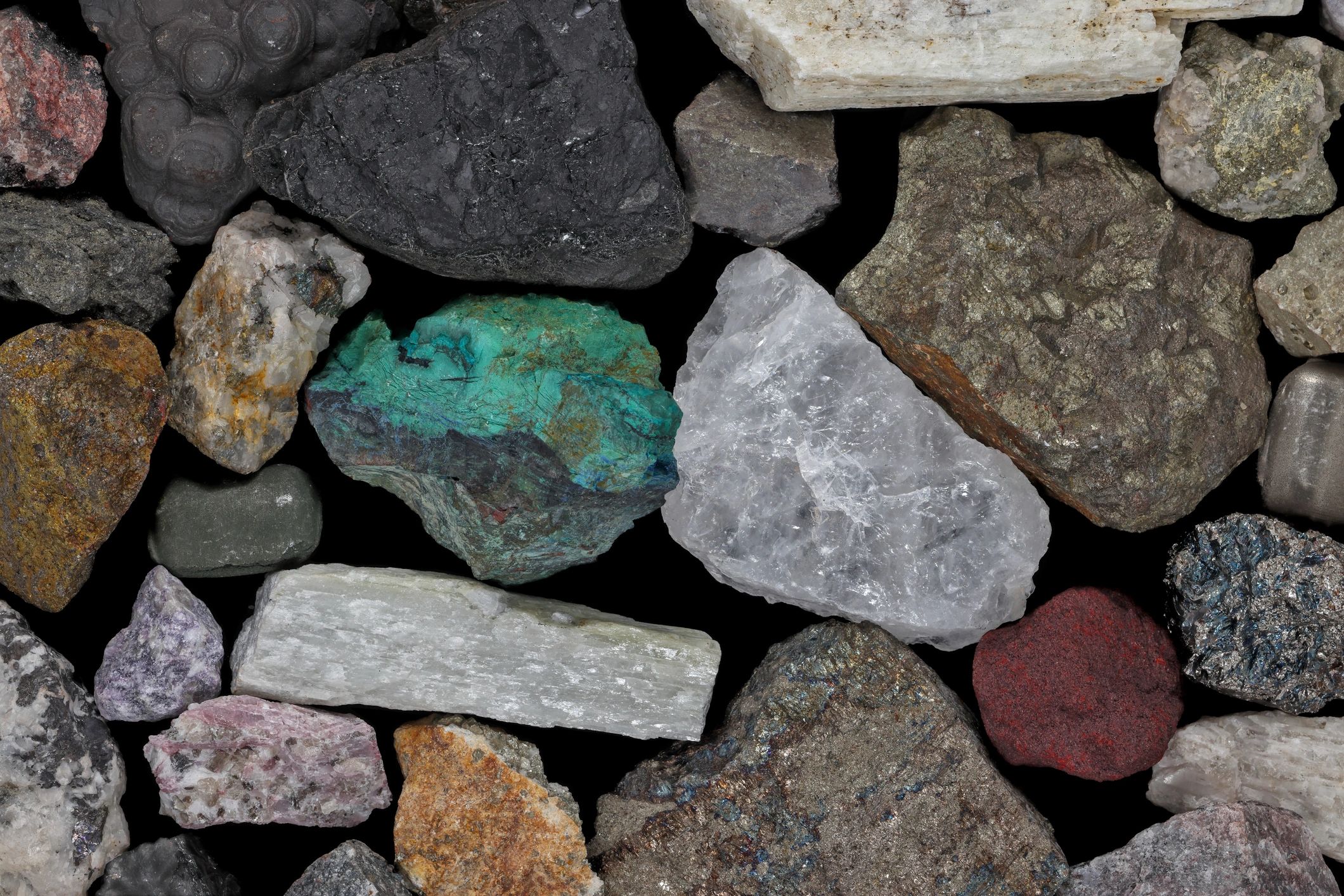 Assorted natural stones and minerals representing stone materials and cultural context