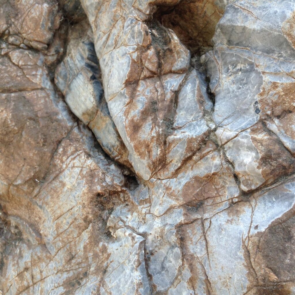 Mineral rock texture. Rocky background with natural cracks.