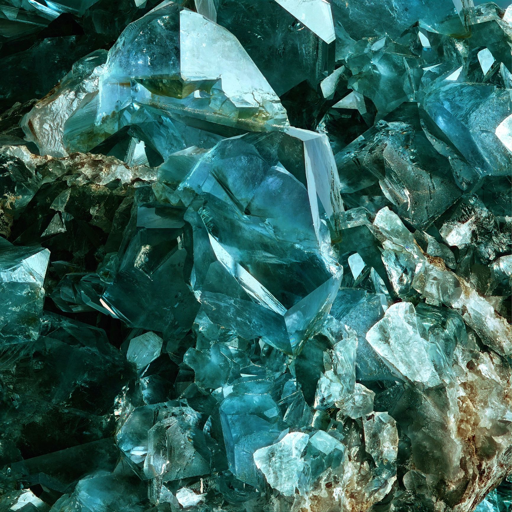 Aquamarine crystal cluster natural transparency and blue-green tones.