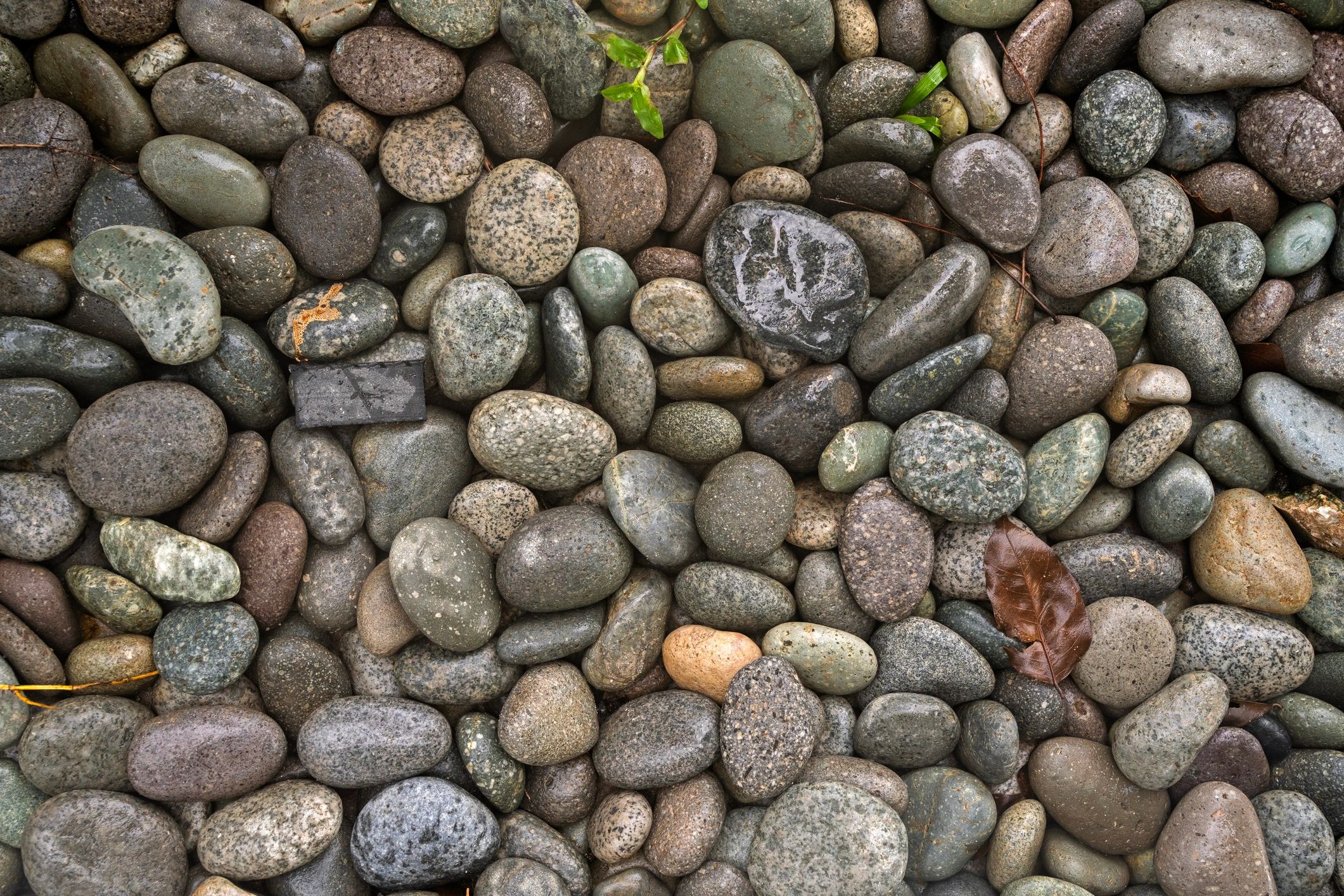 Smooth river stones texture in grey and brown tones