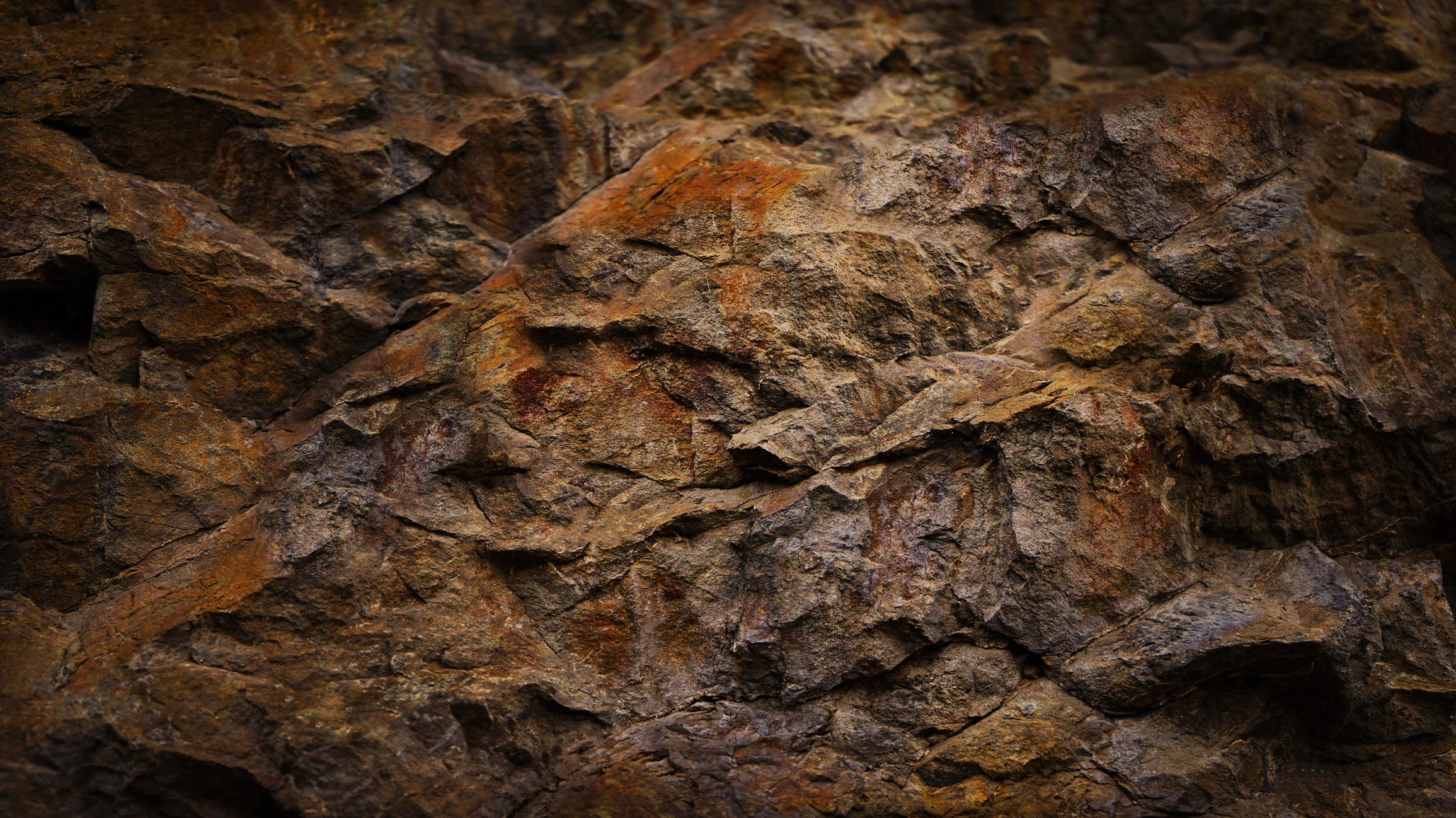 Dark granite-like rock texture close-up