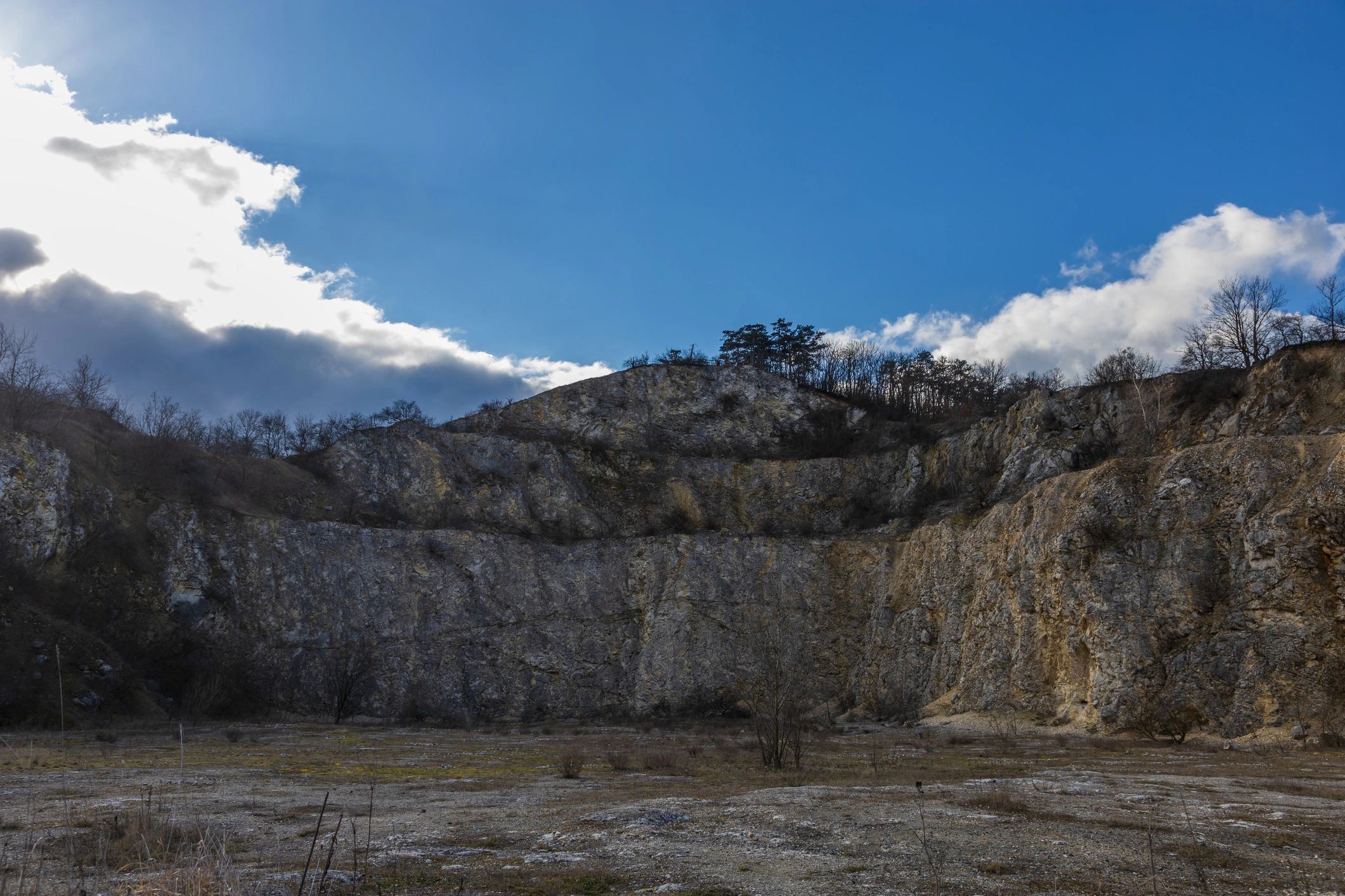 Limestone quarry wall with visible bedding planes